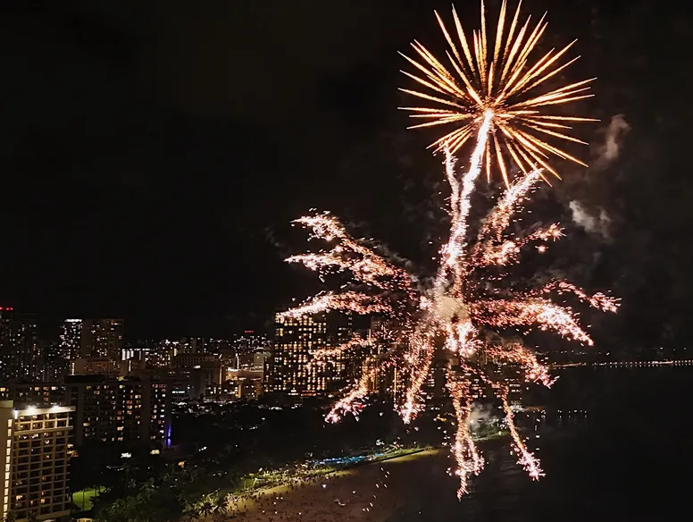 Friday night fireworks over Waikiki seen from the water during a private Sailing Beauty charter.