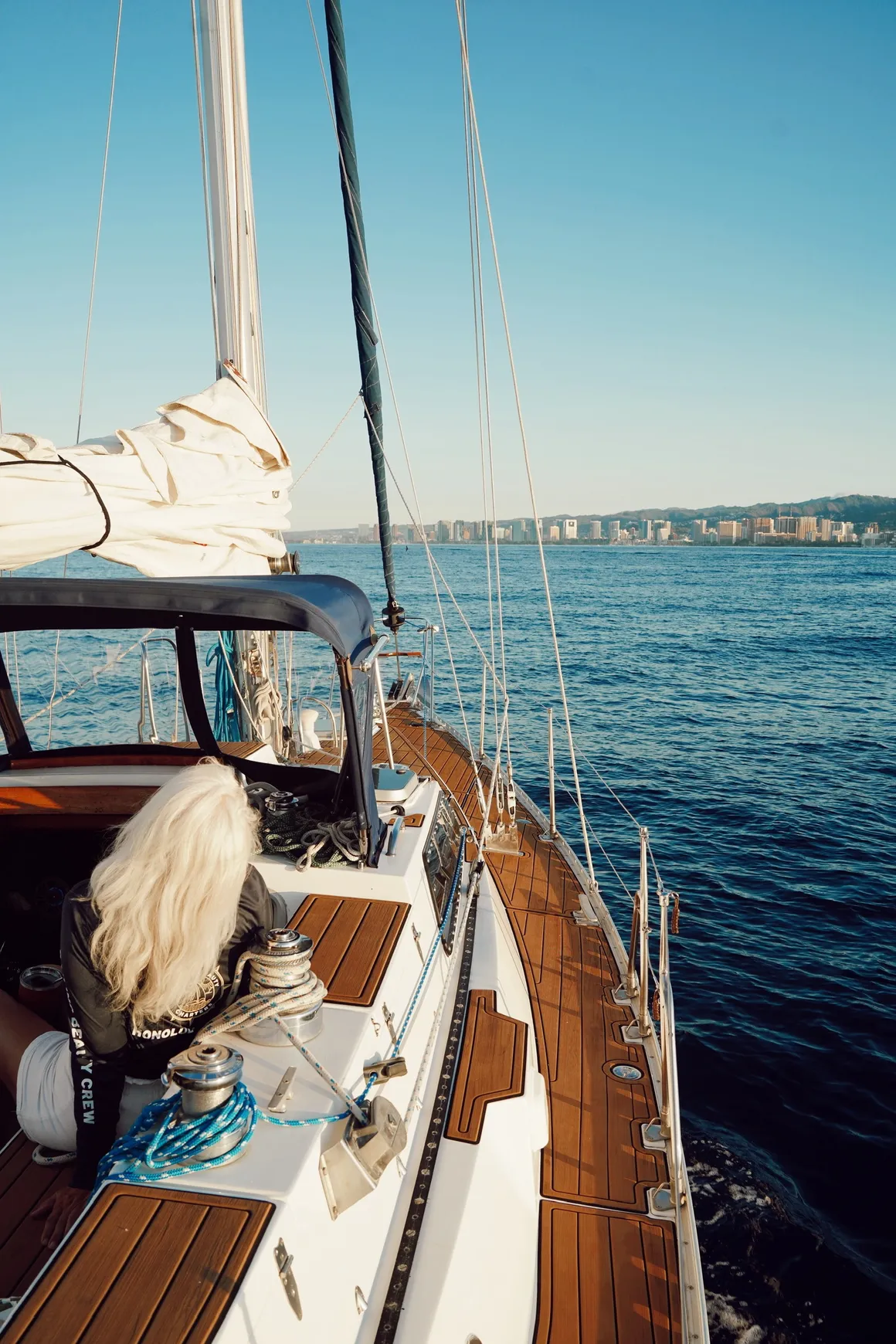 Photo from the back of the boat showing guests aboard Sailing Beauty.