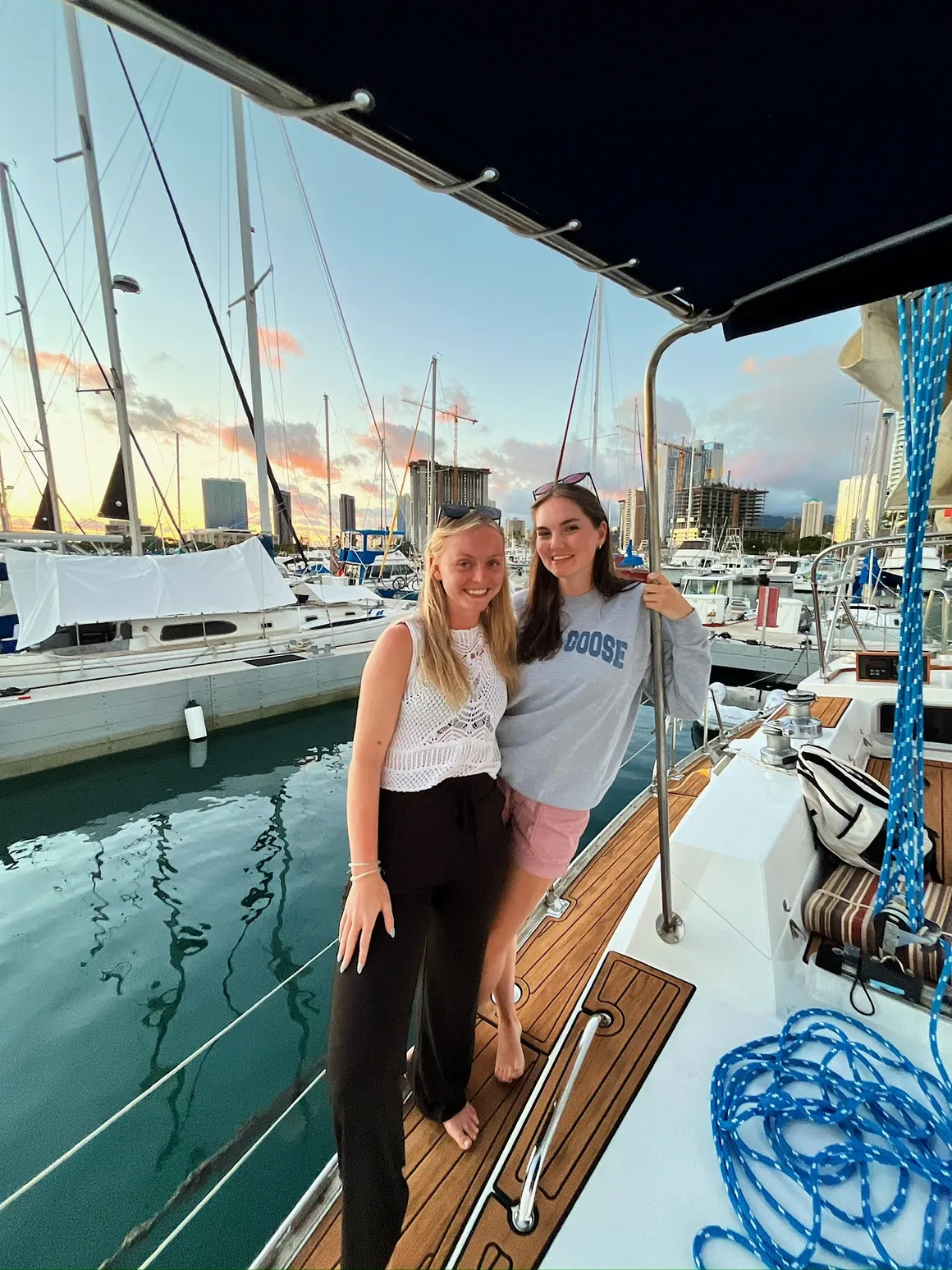 Two women smiling at dock