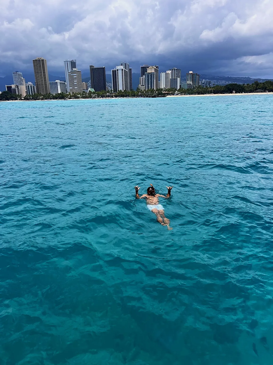 Captain giving shaka from water