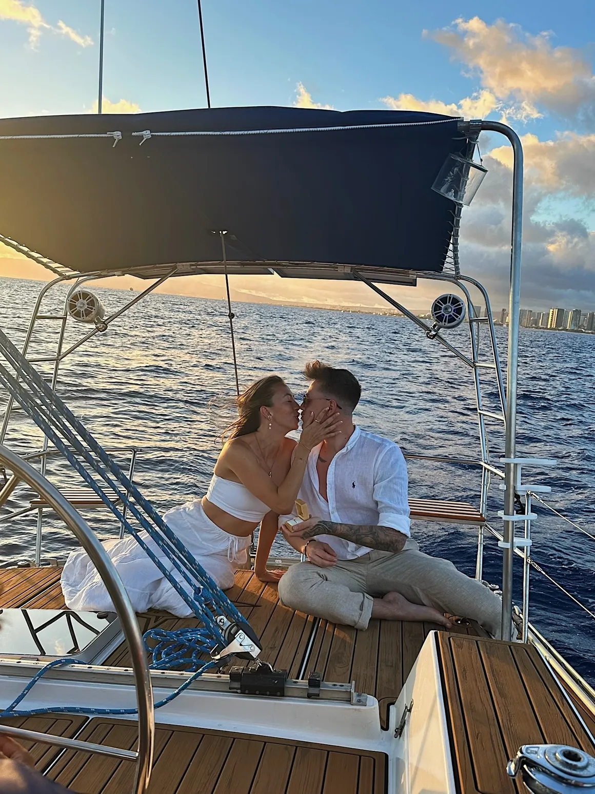 Couple kissing on stern